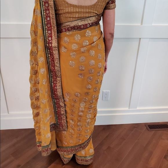 Mustard saree with maroon and teal details and gold embroidery. - Picture 3 of 3